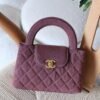 The Chanel Mini Kelly 23K in durable caviar calfskin leather boasts a rigid, compact square form with iconic quilting and antique gold CC turn-lock. Opt for hand carry with the fixed top handle or crossbody via the chain-and-leather strap. Its leather interior includes a zip pocket and slip pocket, holding iPhone 14 Pro, cards, and keys. Sleek with no back pocket, it's a versatile nano essential for everyday Chanel sophistication in Dubai.